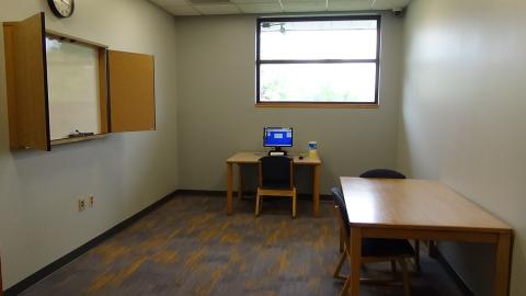 picture of study room 1 with rectangular table and three chairs