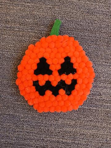 Stop in and make your own mini pompom Pumpkin Coaster.