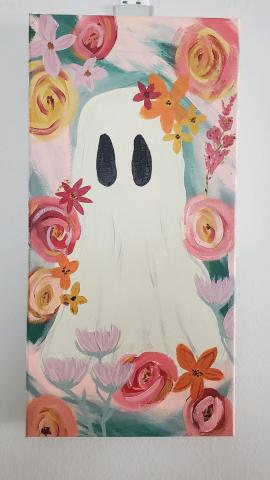 a ghost painted with florals surrounding it