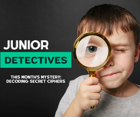 Bold words "Junior Detective" in the top left corner with the words "this month’s mystery: decoding secret ciphers" beneath it. The rest of the image is of a young boy holding a magnifying glass to his eye.