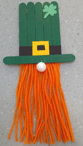 St. Patrick made out of popsicle sticks and yarn.