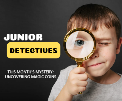Bold words "Junior Detective" in the top left corner with the words "this month’s mystery: Uncovering Magic Coins" beneath it. The rest of the image is of a young boy holding a magnifying glass to his eye.