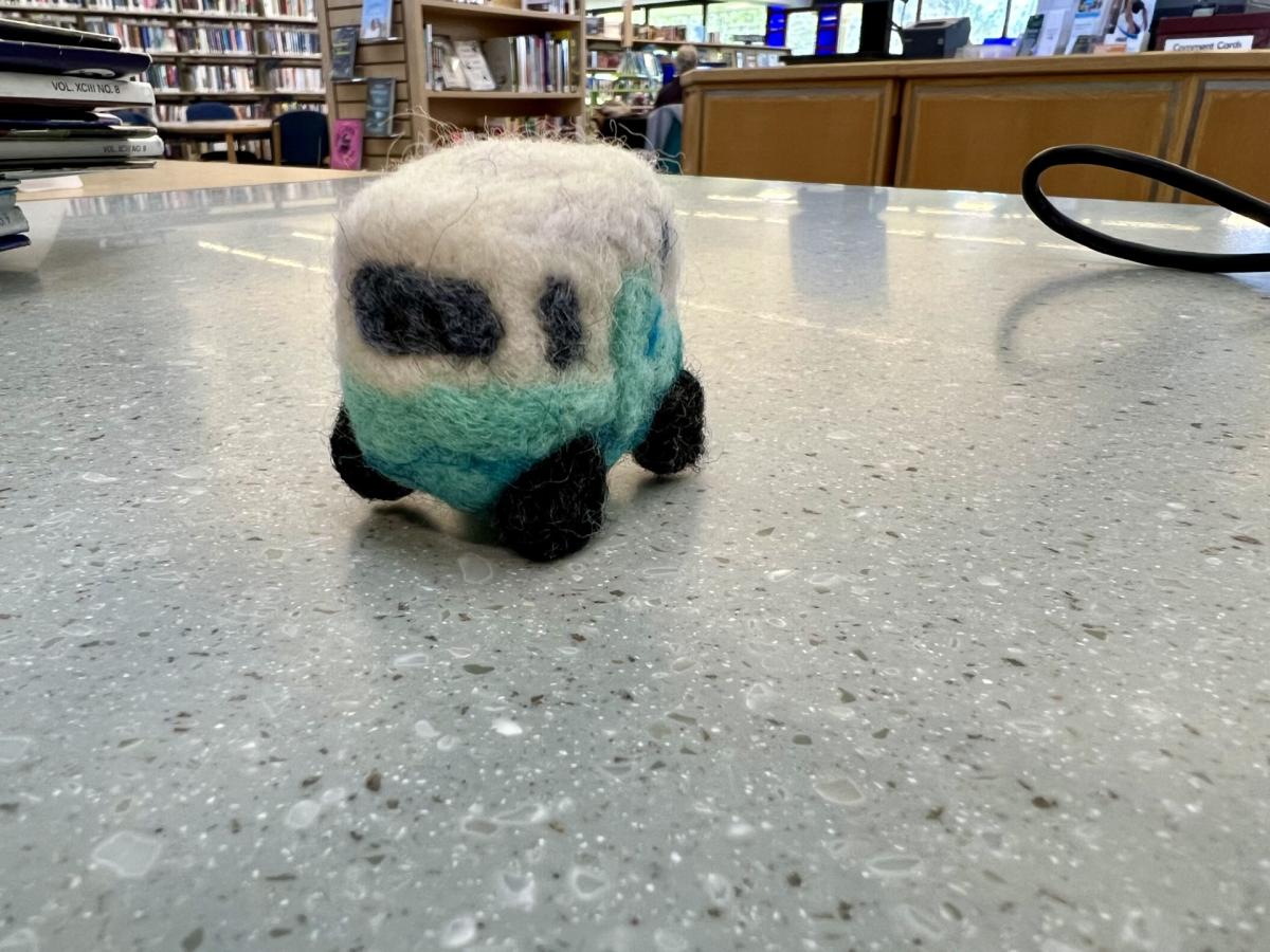 blue and white felted camper on counter top
