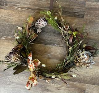 wreath made with greenery and other flowers